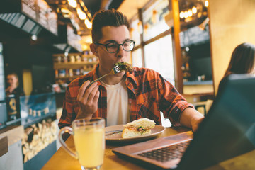 Man eating in a restaurant and enjoying delicious food
