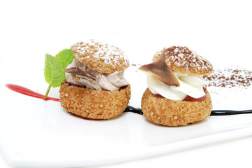 Profiteroles with vanilla ice cream decorated with chocolate mint