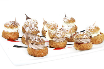 Profiteroles with vanilla ice cream decorated with chocolate mint