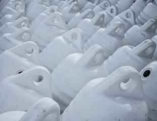 Obraz premium Marine themes, white buoys on the shore in the winter. Close up