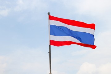 Thai flag, waving in the wind with beautiful with blue sky