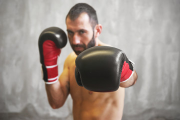 Fototapeta na wymiar Boxing man ready to fight