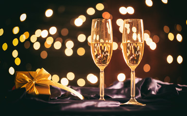 Champagne glasses on bokeh background