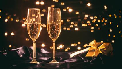 Champagne glasses on bokeh background