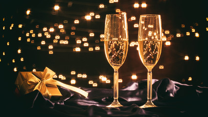 Champagne glasses on bokeh background