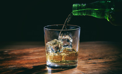 Pouring whiskey in a glass