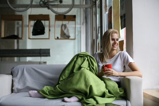 Woman resting in a couch.