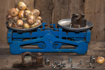 Bow to weigh on the old scale, spices, food for sale, small business, agriculture,