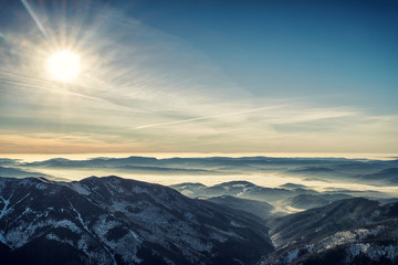 inversion in mountains and colorful sky