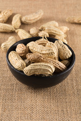 Closeup boiled peanuts in black cup, street food of Thailand.