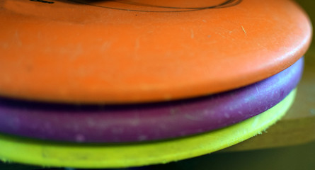 Used disc golf discs close up.