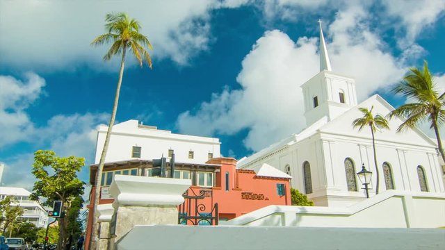 Panning Towards The Wesley Methodist Church in Hamilton, on a Sunny Day in Bermuda with Green Trees and White Clouds in a Blue Sky