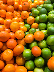 Lime And Tangerines Citrus Fruits In Fruit Market