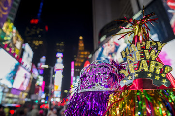Happy New Year hats celebrating in Times Square, New York City