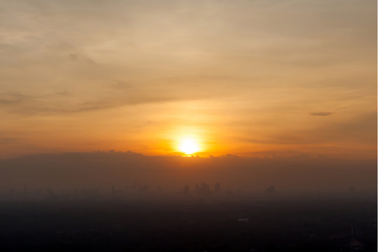 Fototapeta Sunrise over downtown Bangkok, Thailand.  Silhouette cityscape.