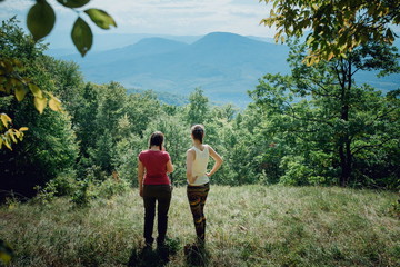 girls on the background of the mountains at one with nature