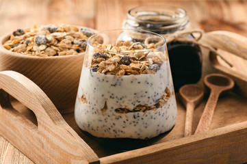 Natural yogurt with chia seed, muesli and jam.