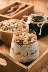 Natural yogurt with chia seed, muesli and jam.