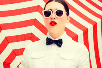 Fashion portrait of a beautiful girl with bright painted lips