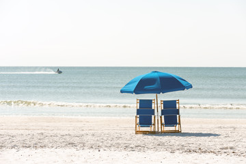 Lounge chairs on pristine sandy beach of Fort Meyers, Florida
