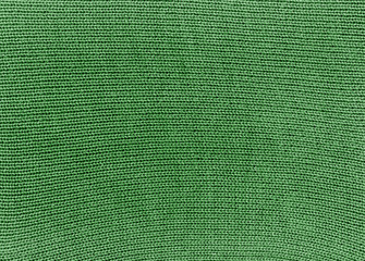 Fototapeta premium Green knitted material texture.