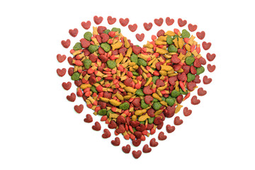 Obraz na płótnie Canvas Dry cat food in heart shape isolated on white. Cat food backgrounds.
