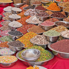 Some of the contents of a sweet and spice stall in a street market in Ahmedabad