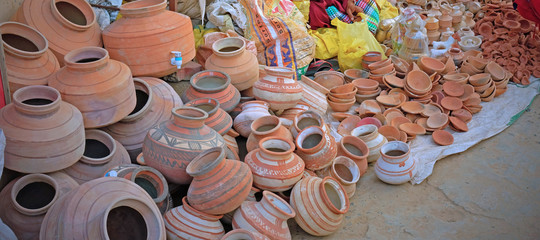 Clay pots for sale at a roadside in Gujarat