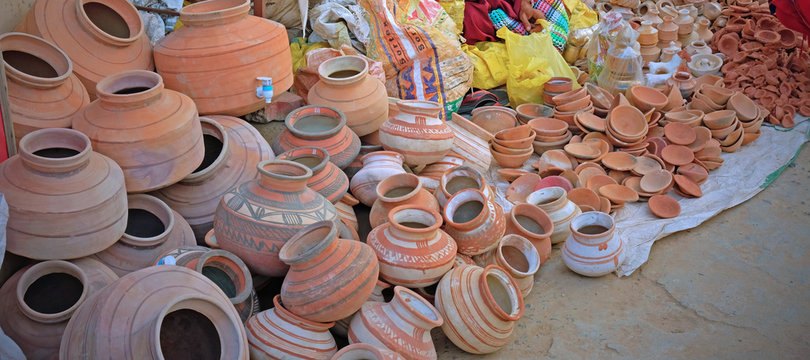 Clay pots for sale at a roadside in Gujarat