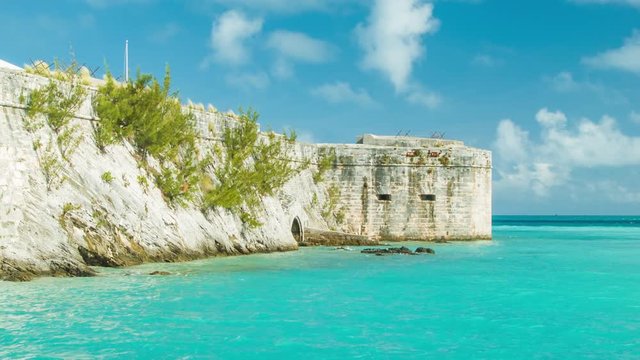 Historic Fort Architecture at the Royal Naval Dockyard King's Wharf in Bermuda, featuring Tropical Waters and White Clouds in a Blue Sky on a Sunny Day