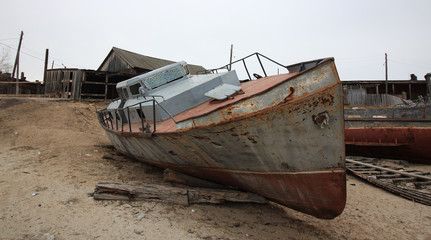 Fototapeta na wymiar Abandoned ship,fishing vessel at the bottom seafood production