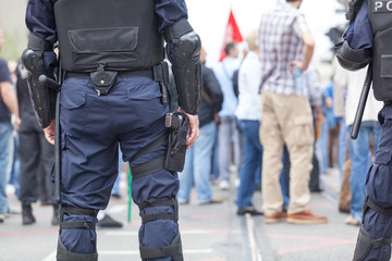 Police officers at street protest. Law enforcement.