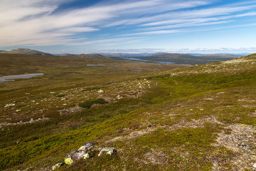 Standing on hill top overlooking a river and mountains