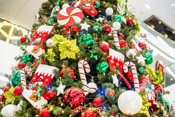 Christmas background-colored toys hang on the Christmas tree 