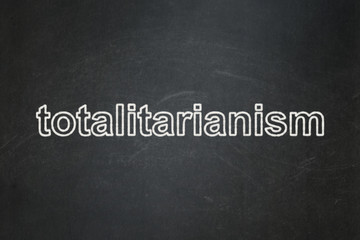 Political concept: Totalitarianism on chalkboard background