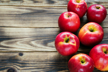 red apples on a wooden background