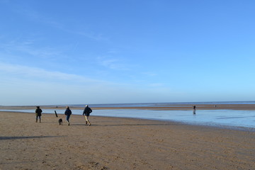 beach people walking on the beach 