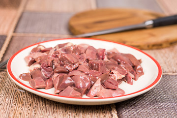 Sliced raw chicken liver on the plate
