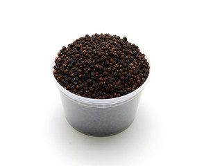 dried black peppercorns isolated on white background