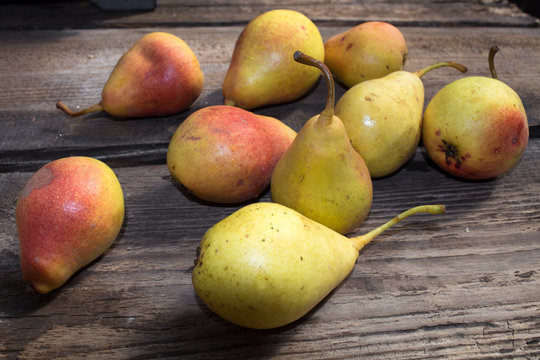 Yellow pears on old table, ripe pears, food for sale, small business, agriculture,