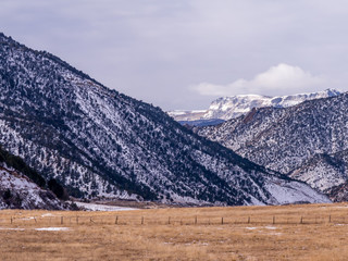 Dry Pasture with Snowy Hills