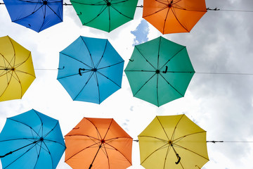 Creative decorative background from color umbrella above the str