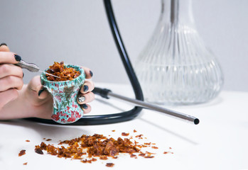 Hookah bowl with tobacco leaf 