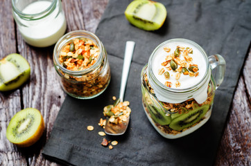 Greek yogurt granola kiwi breakfast in jar