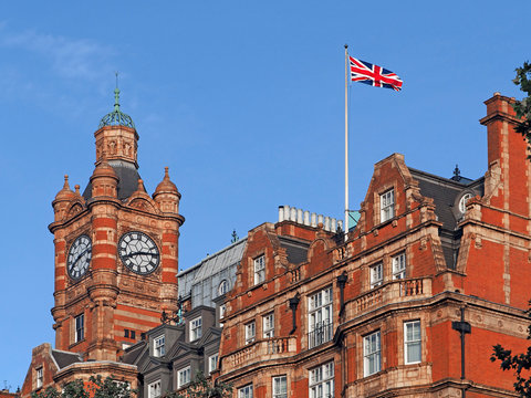 gothic building such as a college or town hall, with British flag