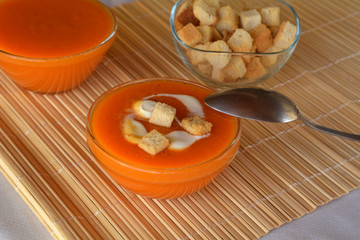 Pumpkin Creme Soup On A Bowl With Heavy Cream. 