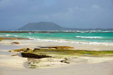 Turquoise ocean on sand dunes Fuerteventura, Corralejo, Canary Islands