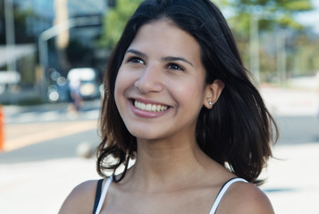 Attractive caucasian woman in the city in the summer