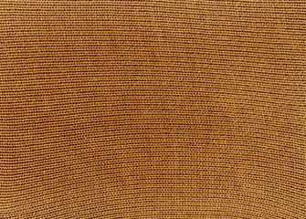 Orange knitted material texture.