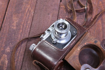 Vintage old film photo-camera in leather case